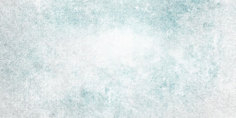 Obraz premium An abstract blue watercolor and grunge texture background featuring a frozen winter design with icy crystal patterns, liquid water splashes, and soft Christmas snowflake light