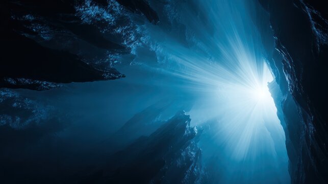A cavern interior with light flooding through a crevice, creating a luminous glow