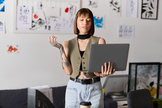 Creative young woman engages with her laptop in an artistic home environment filled with inspiration