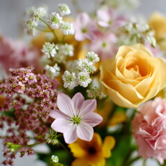 Closeup of flower bouquet with mixed spring flowers, shallow depth of field, women day celebration