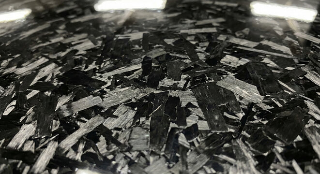 Forged carbon fiber texture with black chaotic marble pattern for automotive design