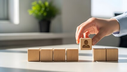 Human resources recruitment and talent selection. Leadership and career development. Person placing wooden block with human icon into missing gap of row