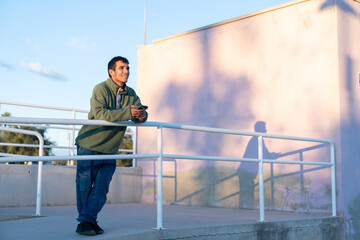 Man smiling reflecting on day at sunset © Araguatai