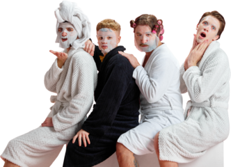 Four men in bathrobes posing playfully with face masks on transparent background. Concept of social media content, selfcare humor, lifestyle storytelling for online marketing campaigns.