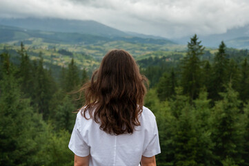 young woman in the mountains
