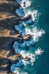 Aerial View of Waves Crashing Against Rocky Coastline