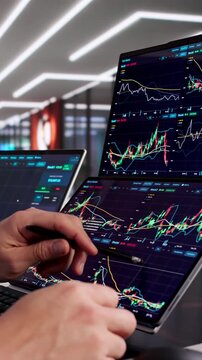 Man Analyzing Stock Data On Computer