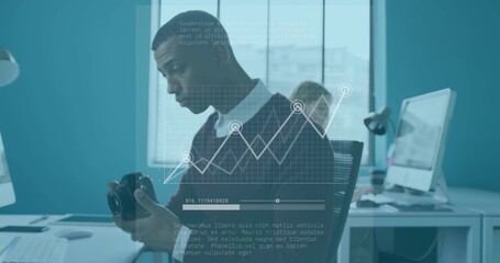 Inspecting DSLR camera, photographer in dark sweater checking controls in office with monitors, HUD