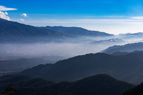 Foggy sunrise over the Cordillera de la Costa mountain range in Miranda State, Venezuela. Guarenas and Guatire