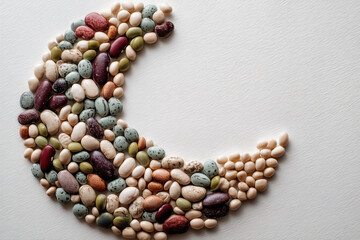 Rice White Moon Shape Formed by Varied Colorful Beans on Textured Surface for Creative