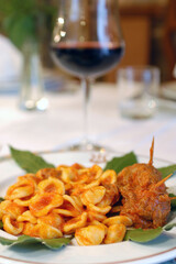 Orecchiette al sugo con ragù di braciole or orecchiette whit sauce tomato ragù is typical food...