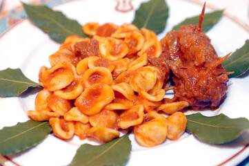 Orecchiette al sugo con rag&ugrave; di braciole or orecchiette whit sauce tomato rag&ugrave; is typical food Puglia region in Italy