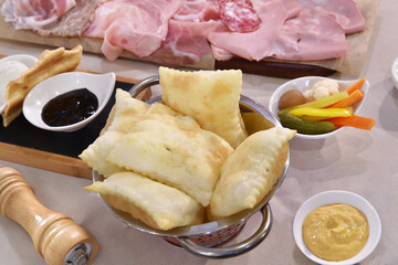 Crescentina con I salumi is typical food from Bologna in Emilia Romagna region in Italy