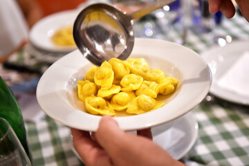 Tortellini in brodo or tortellini in broth is typical food from Bologna and Emilia Romagna region in Italy