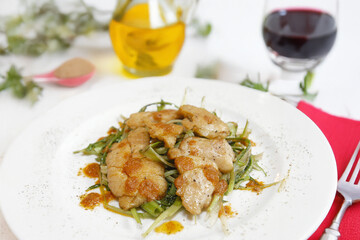 Animelle con I porri or meat sweetbreads with leeks typical food of Rome area in Lazio region Italy