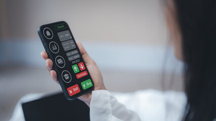 Businesswoman hand holding smartphone with trading app interface for investment, stock market, forex and cryptocurrency exchange concept.