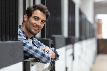 young man looking after horses