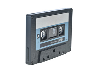 Obraz premium Old vintage audio cassette close up isolated on white background. Front focus