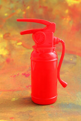 Obraz premium Fire extinguisher. Background stains simulating a fire - vertical format
