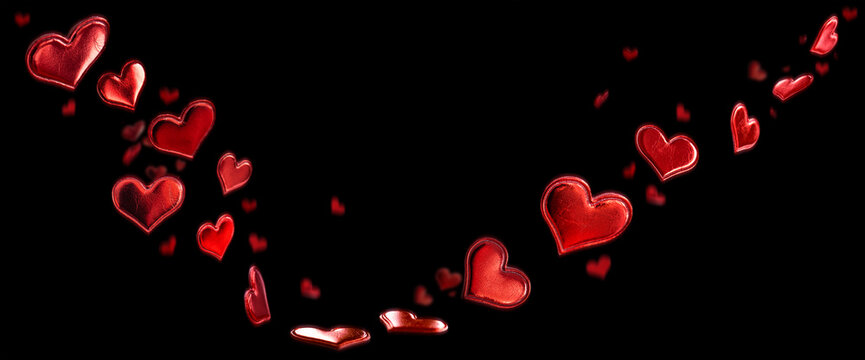 Bright red hearts on black background for valentine's day. Horizontal romantic concept background for love greetings.