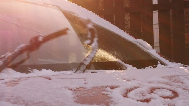Windscreen wipers clear car windsheild from snow