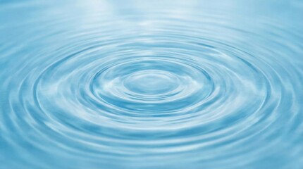 Water ripple with concentric waves on a smooth surface,clean and calm water background for nature,wellness and spa concepts,tranquil and minimal design