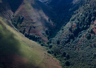 Aerial drone view of the landscape around San Pedro del Romeral. Pas-Miera region. Pasiegos Valleys. Cantabria. Spain. Europe