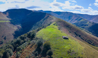 Aerial drone view of the landscape around San Pedro del Romeral. Pas-Miera region. Pasiegos Valleys. Cantabria. Spain. Europe