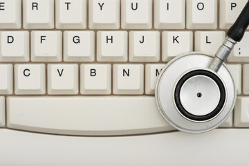 Stethoscope on keyboard digital healthcare concept
