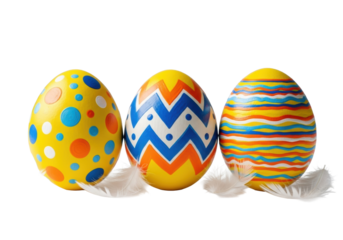 three vibrant yellow easter eggs with intricate blue, orange, and white patterns, displayed neatly on a white surface with soft scattered feathers, concept of easter and spring holidays