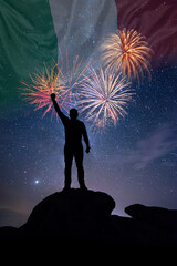 Man against background of a fireworks and national flag of Italy