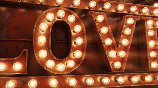 Love Marquee Sign - This is a close up video of a vintage-style "LOVE" marquee sign, illuminated with incandescent bulbs.