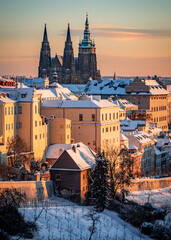 Fototapeta premium city, architecture, church, czech, night, view, sunset, europe, travel, skyline, cityscape, snow, building, prague, landmark, sky, landscape, tower, winter, cathedral, old, castle, charles, tourism