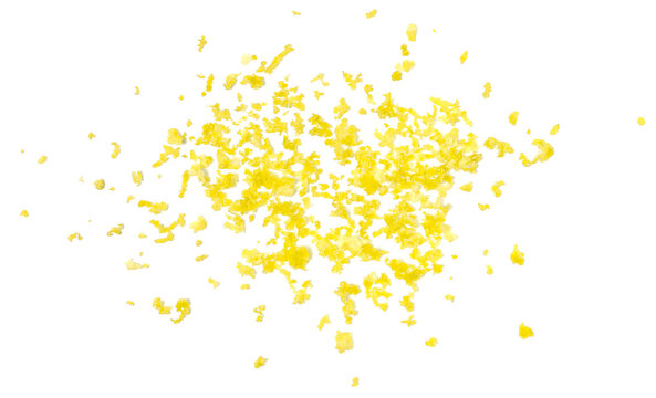 Fresh grated lemon peel flying isolated on white background, top view