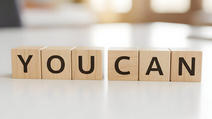 wooden blocks spelling &ldquo;YOU CAN&rdquo;, empowerment message
