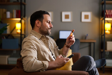 Man shopping online using credit card and smartphone