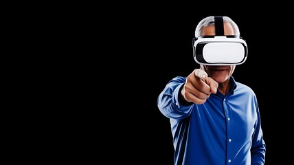 A man wearing a virtual reality headset points forward with a blue shirt on a black background