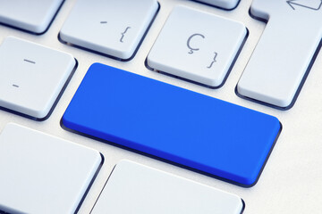 Blue blank key on white computer keyboard mockup