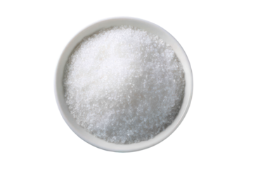Close up of white granulated sugar in a shallow dish isolated on transparent background. Close-up view of a textured metallic plate with granulated sugar isolated on white background.