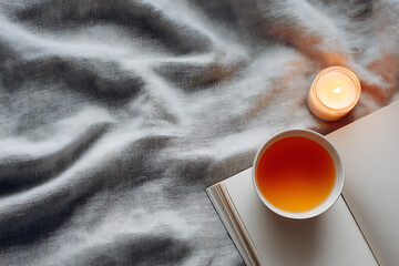 wellness morning vibes, neutral flat lay with gratitude journal, candle, tea cup, and linen background in soft morning light, ideal for cozy wellness vibes