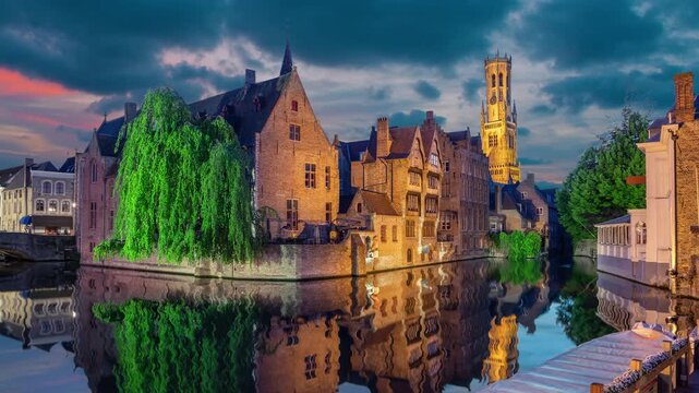 Brugge, Belgium. Cityscape from famous Rozenhoedkaai viewpoint at dusk (static image with animated sky and water)