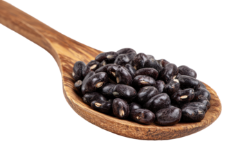 Wooden spoon full of black beans isolated on transparent background. Black beans filling a wooden spoon isolated on white background.
