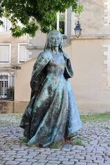 Bronze statue of Anne Duchess of Brittany stands proudly in summer Nantes, France.