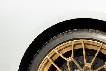 car wheel tire and white metallic frame background close up transport vehicle background concept