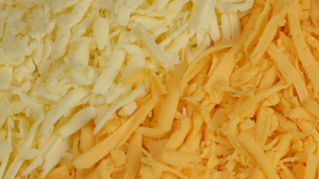 Zoom frame two different types on grated cheese, rotate