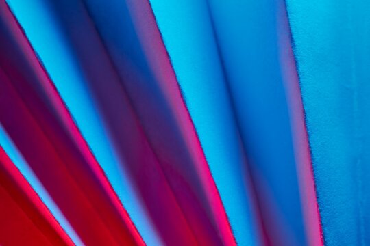 Fan-shaped paper texture with chromatic contrast.