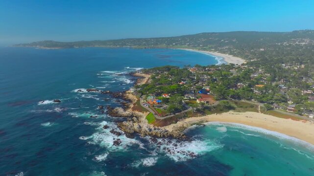 aerial drone view of Carmel by the Sea, California with neighborhood and beach