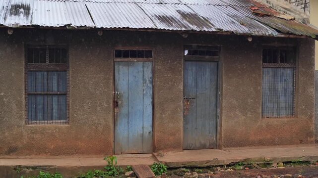 Door and window seen from a hallway in the morning in Africa, a morning in Uganda