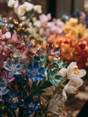 A A bouquet of gemstone flowers in front of a floral shop, surreal flowers, gemstone flowers, cute and innovative flowers, romance, romantic