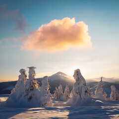 Naklejka premium Winter mountains at sunrise with snowy peaks and warm colorful clouds. Scenic snowy landscape with bright morning light